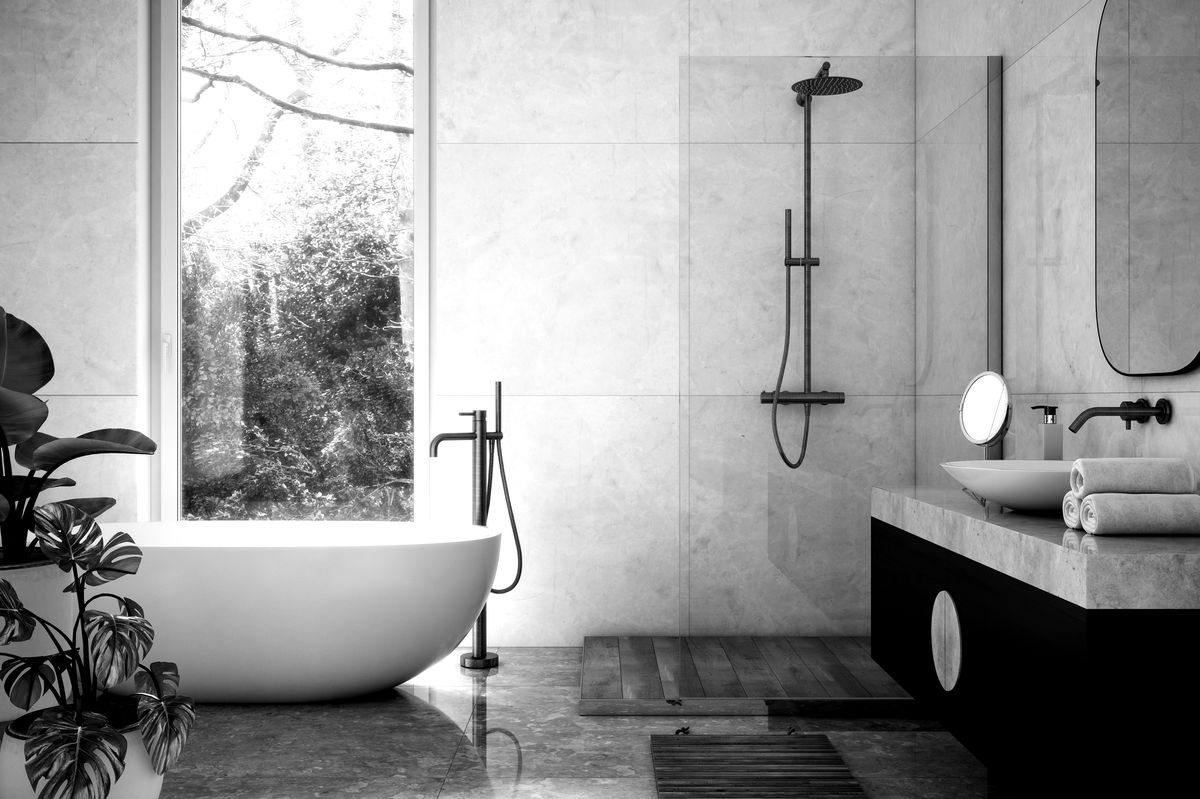 Luxury bathroom with freestanding tub and garden view