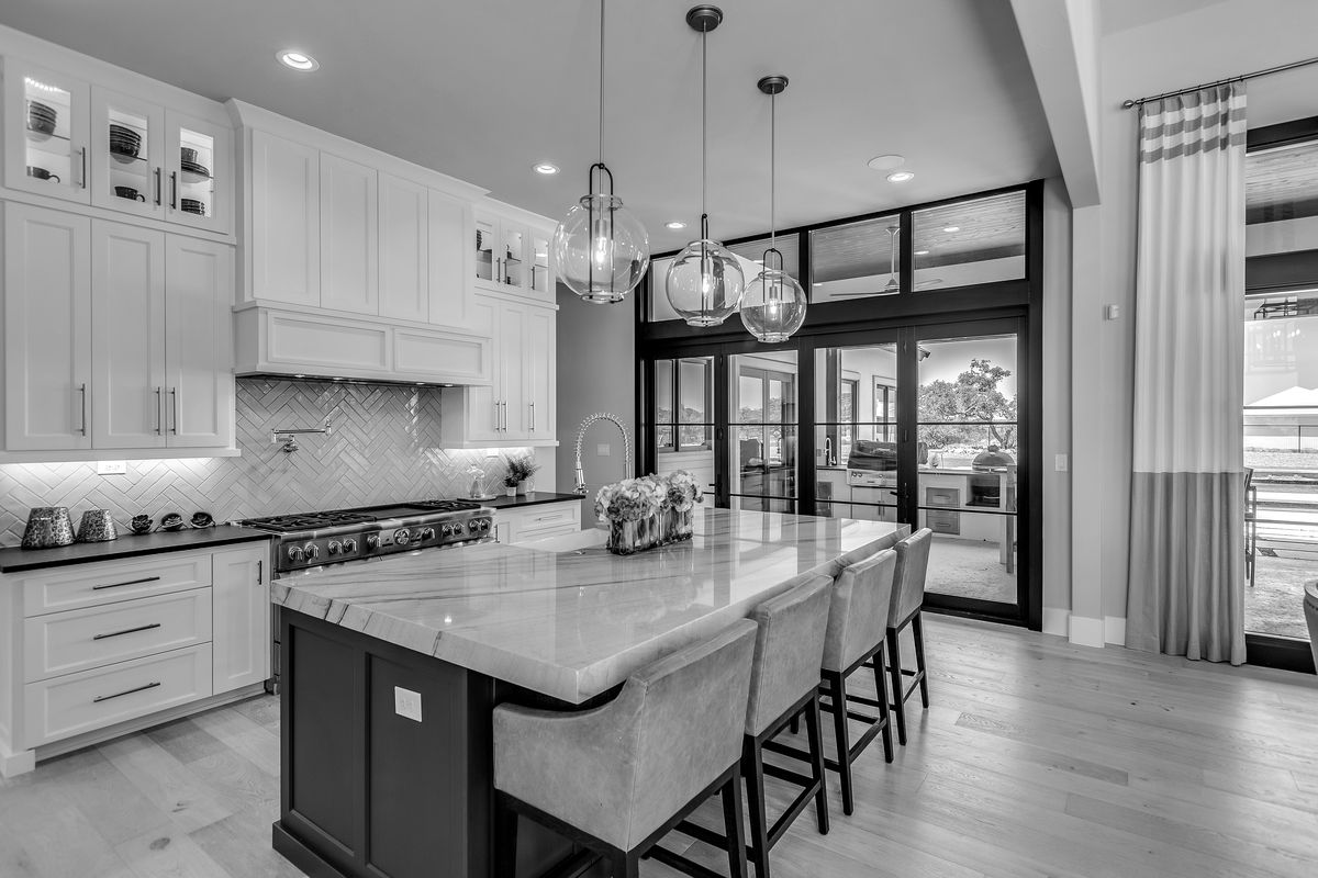 Upscale kitchen with island and pendant lighting