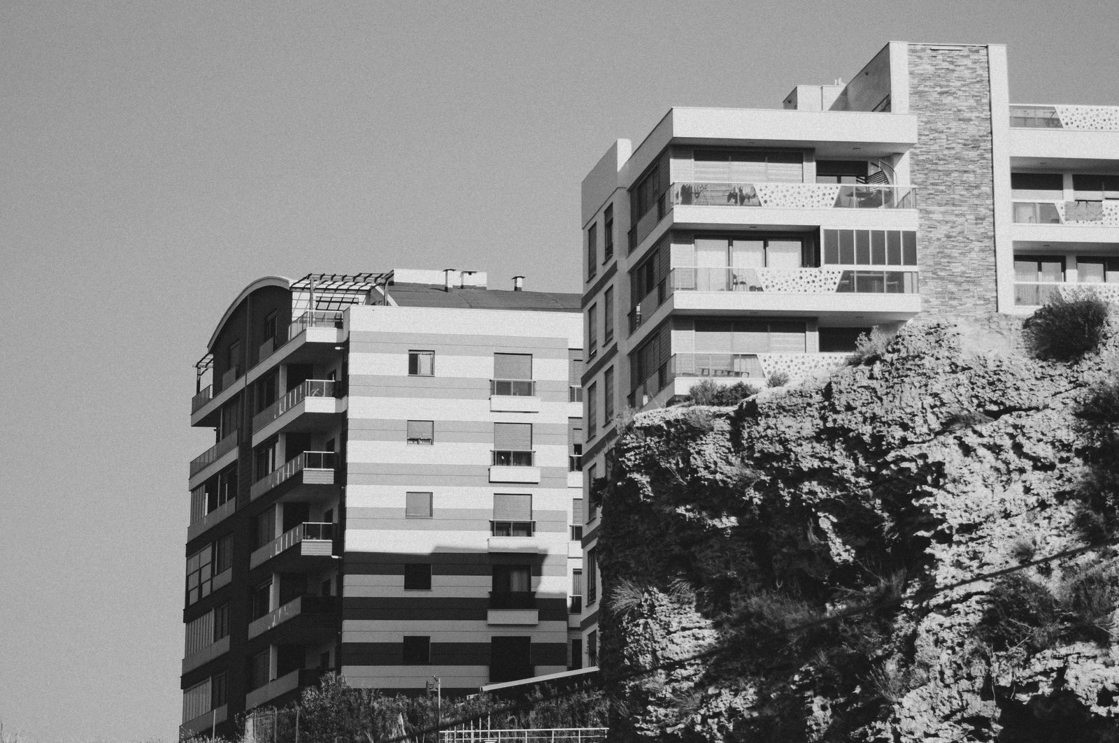A multifamily rental building of the kind an investor might cross-collateralize inside a single portfolio loan