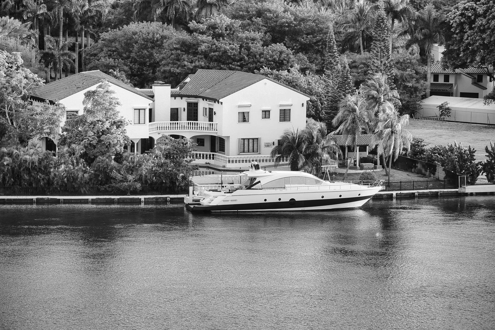 A high-end modern home lit at dusk in an exclusive destination market, the kind of luxury Airbnb financed with a high-value DSCR loan