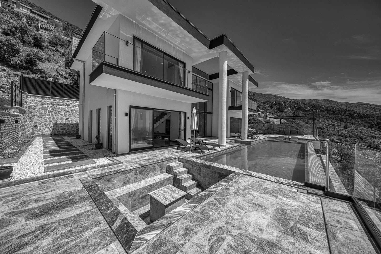 A luxury modern vacation home with a pool, the kind of high-value short-term rental financed on a DSCR loan